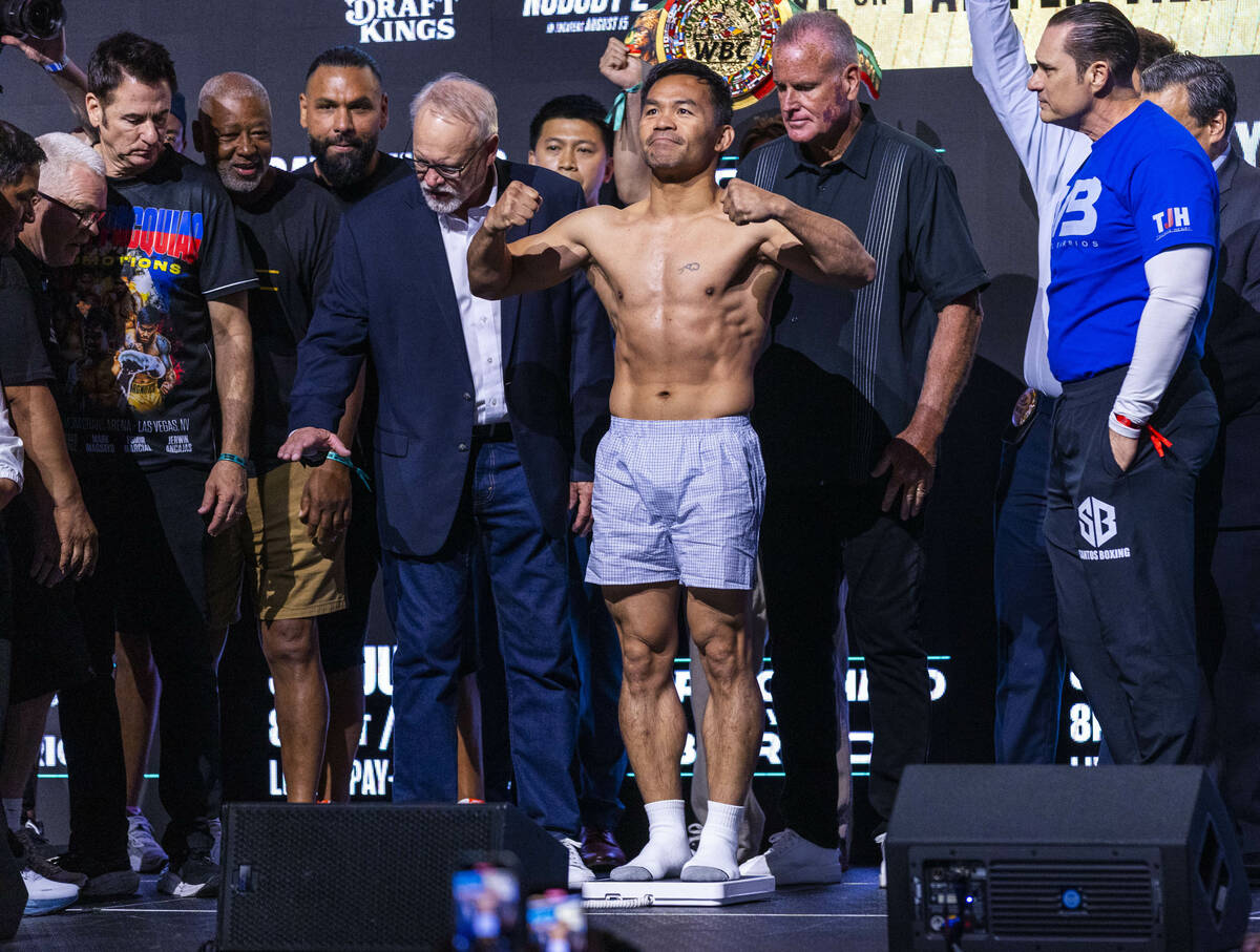 WBC welterweight championship fighter Manny Pacquiao poses during a ceremonial weigh in for his ...