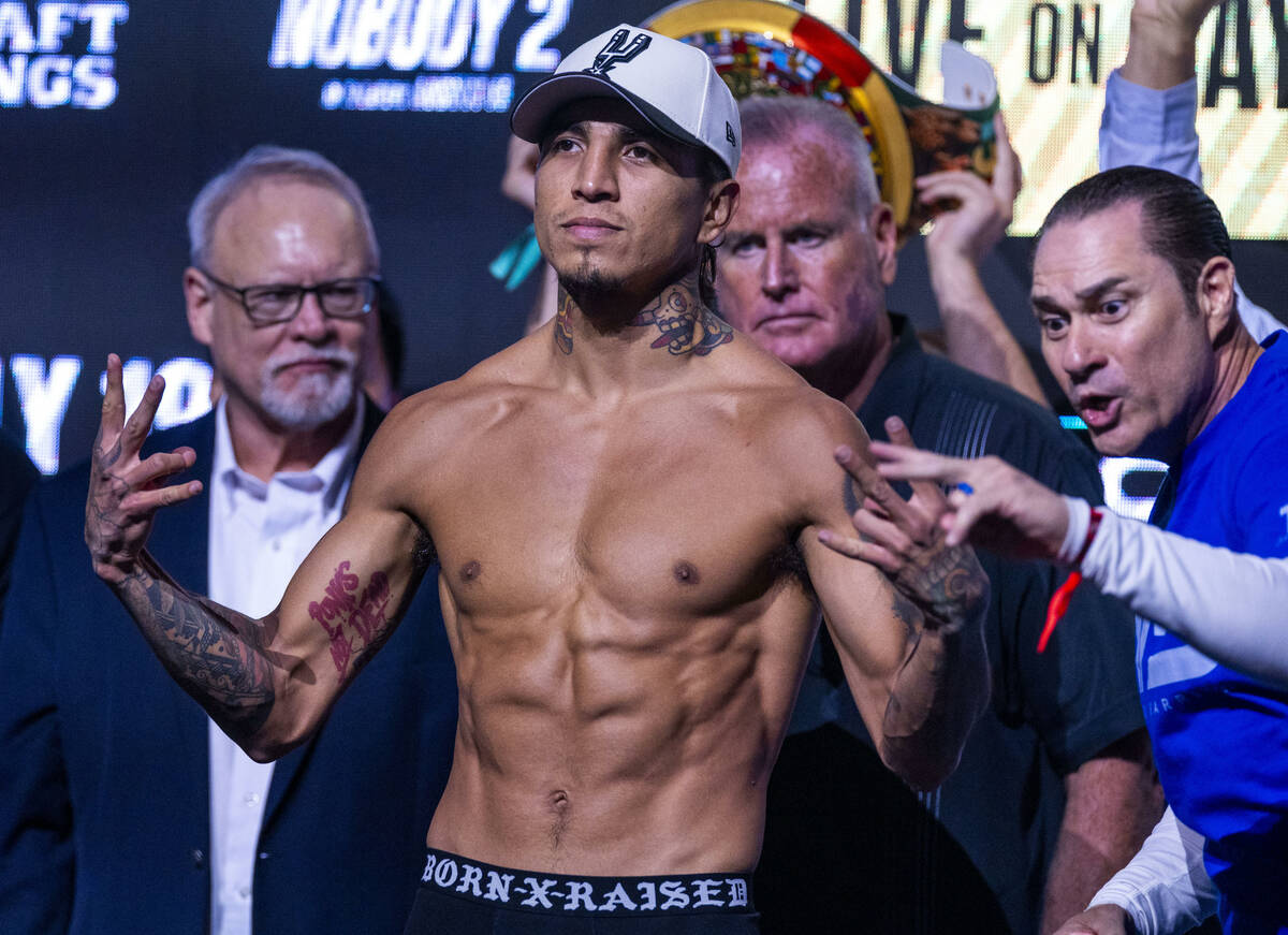 WBC welterweight championship fighter Mario Barrios poses during a ceremonial weigh in for his ...