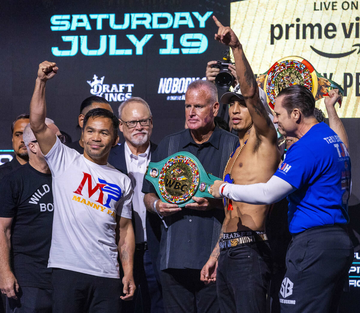 WBC welterweight championship fighters Manny Pacquiao and Mario Barrios pose off during a cerem ...