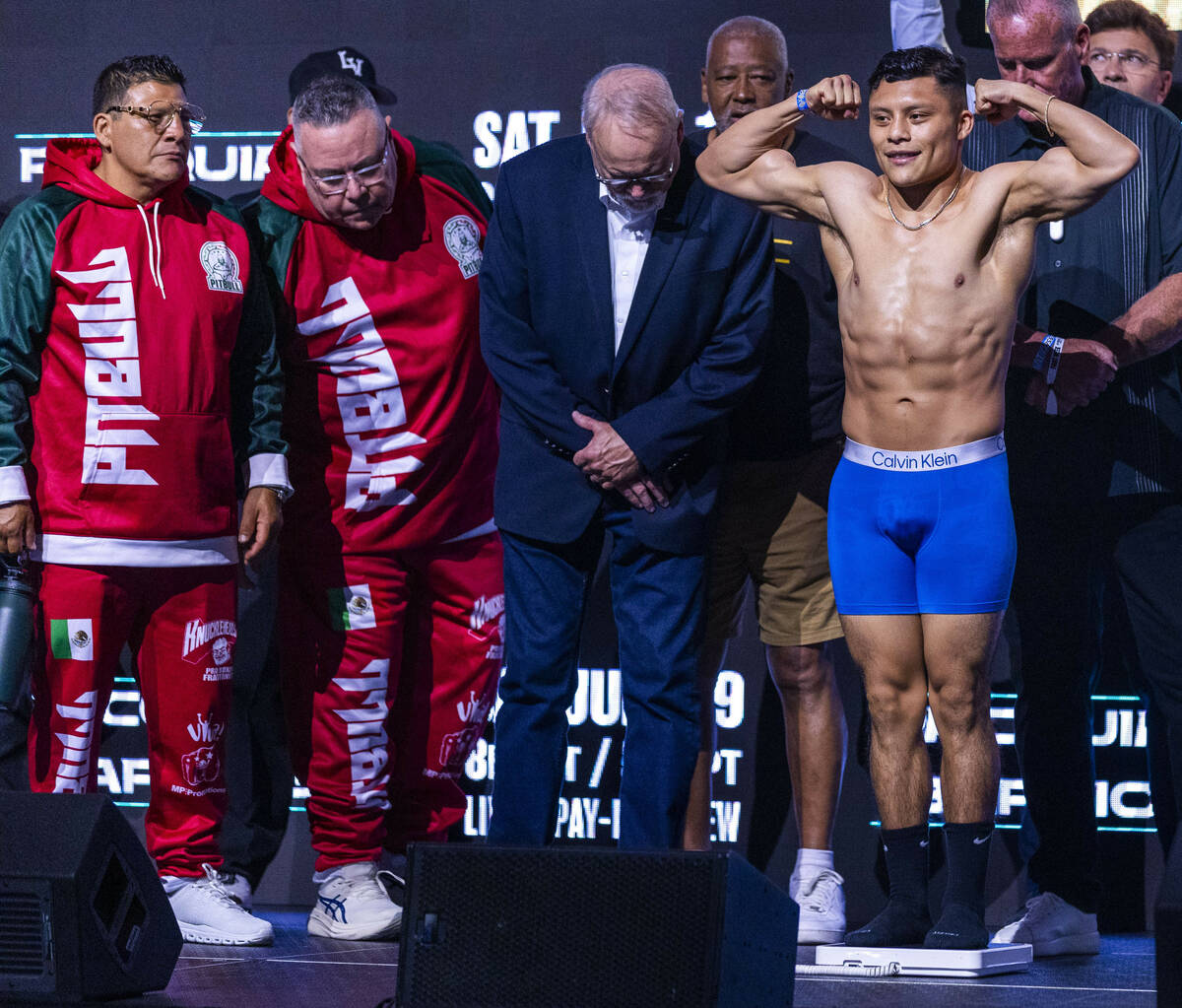 Super lightweight fighter Isaac Cruz poses during his ceremonial weigh in for his upcoming batt ...