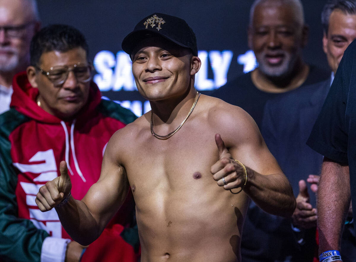 Super lightweight fighter Isaac Cruz poses for the crowd during his ceremonial weigh in for his ...