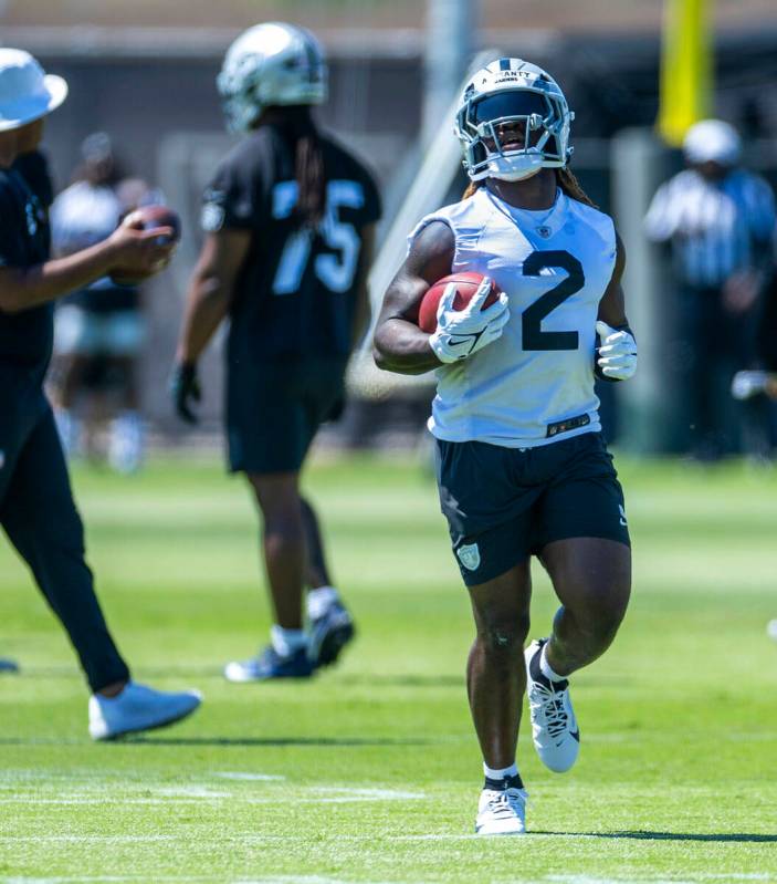 Raiders running back Ashton Jeanty (2) runs the ball up the field during Raiders OTA practice a ...