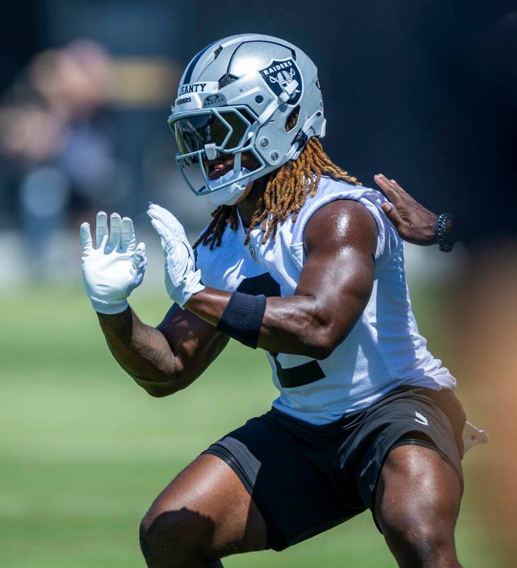 Raiders running back Ashton Jeanty (2) runs a drill during Raiders OTA practice at the Intermou ...