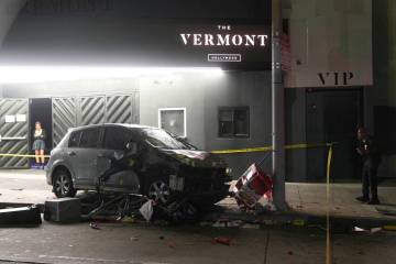 A vehicle sits on the sidewalk after ramming into a crowd of people waiting to enter a nightclu ...