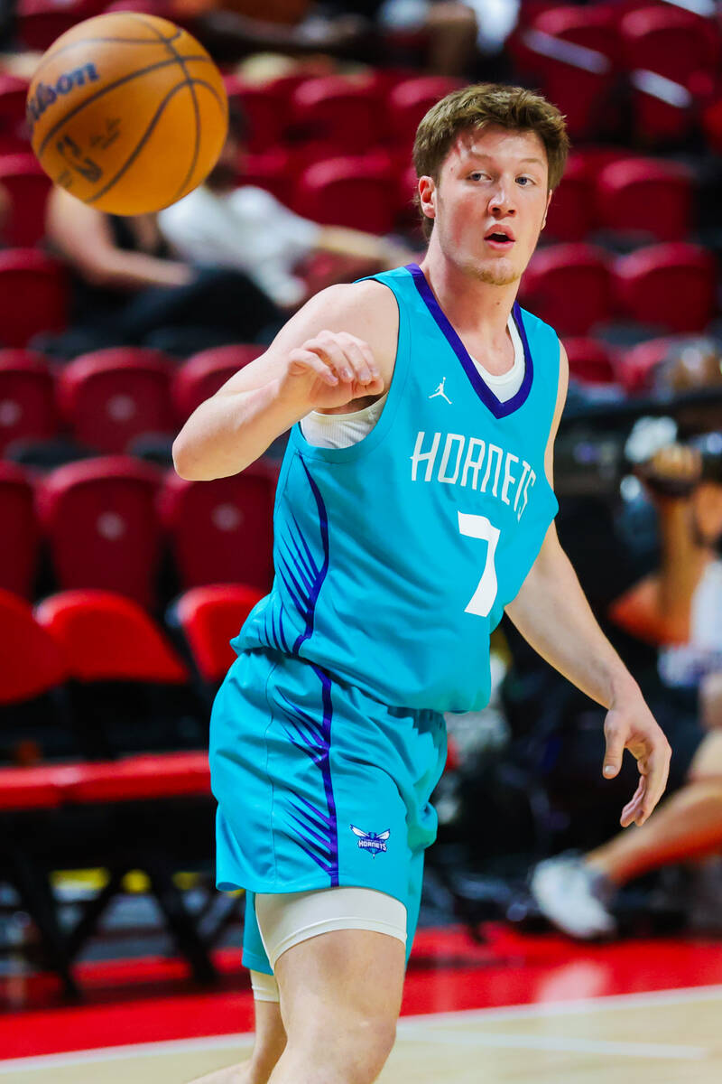 Charlotte Hornets guard/foward Kon Knueppel reaches for the ball as it is passed to him during ...
