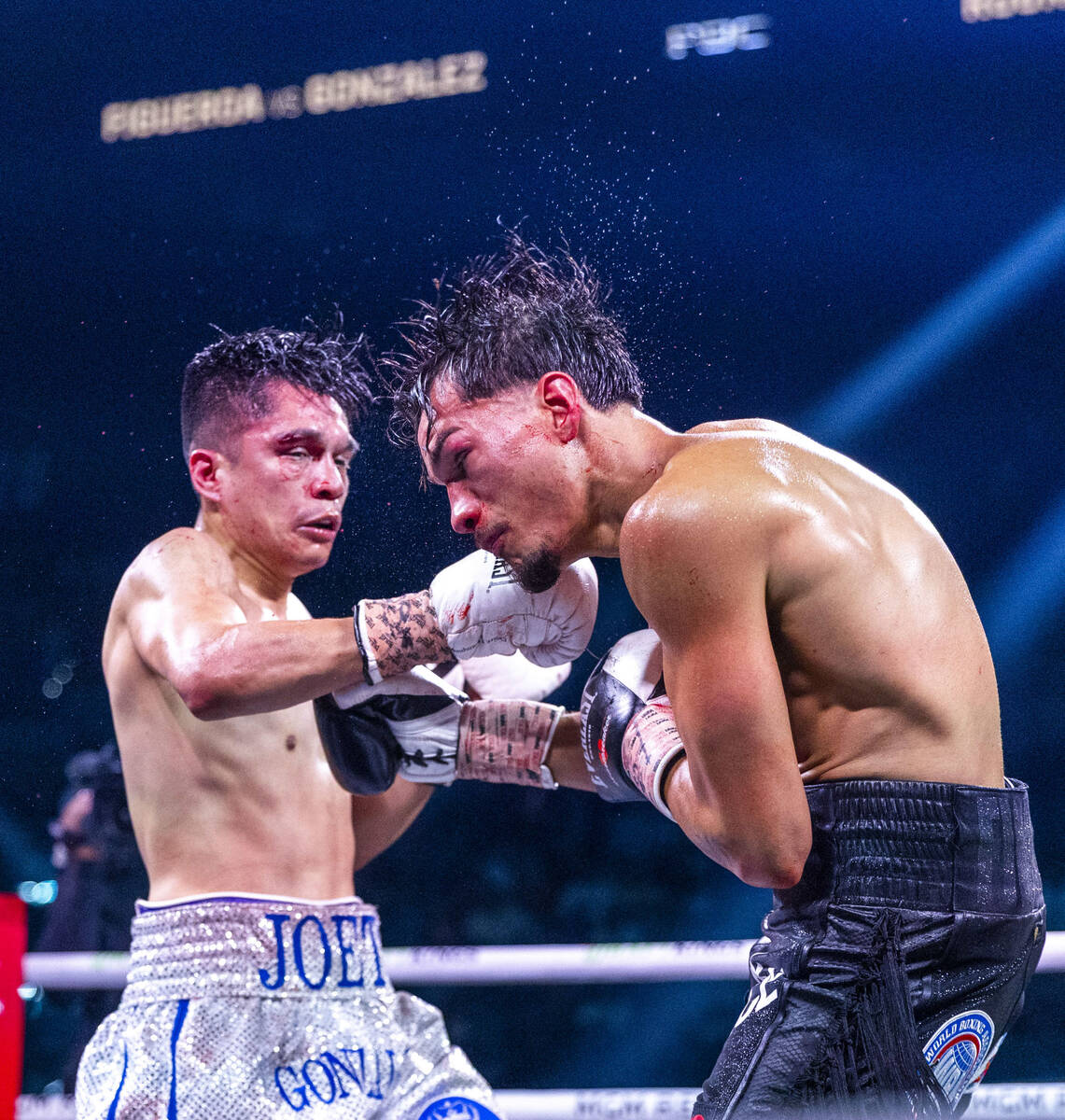 Joet Gonzalez connects with a punch to the chin of Brandon Figueroa during their WBA featherwei ...