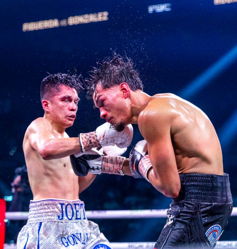 Joet Gonzalez connects with a punch to the chin of Brandon Figueroa during their WBA featherwei ...