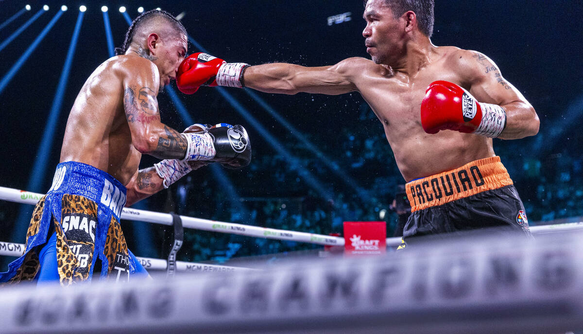 Mario Barrios takes a punch to the face from Manny Pacquiao during their WBC welterweight champ ...