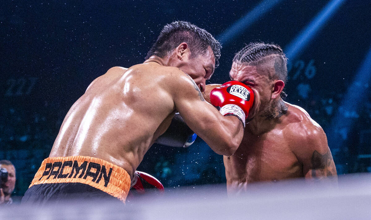 Manny Pacquiao smashes the face of Mario Barrios during their WBC welterweight championship fig ...