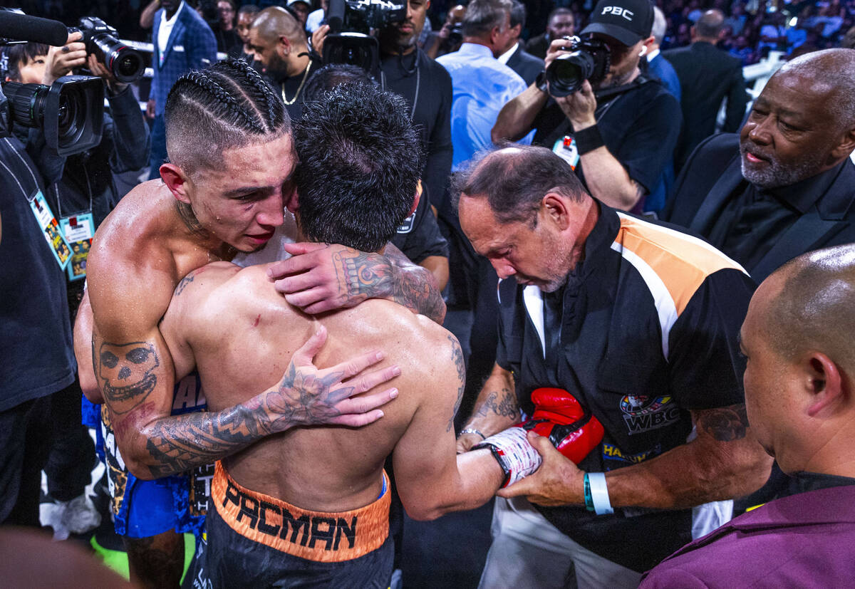 Mario Barrios hugs Manny Pacquiao following their WBC welterweight championship fight at the MG ...