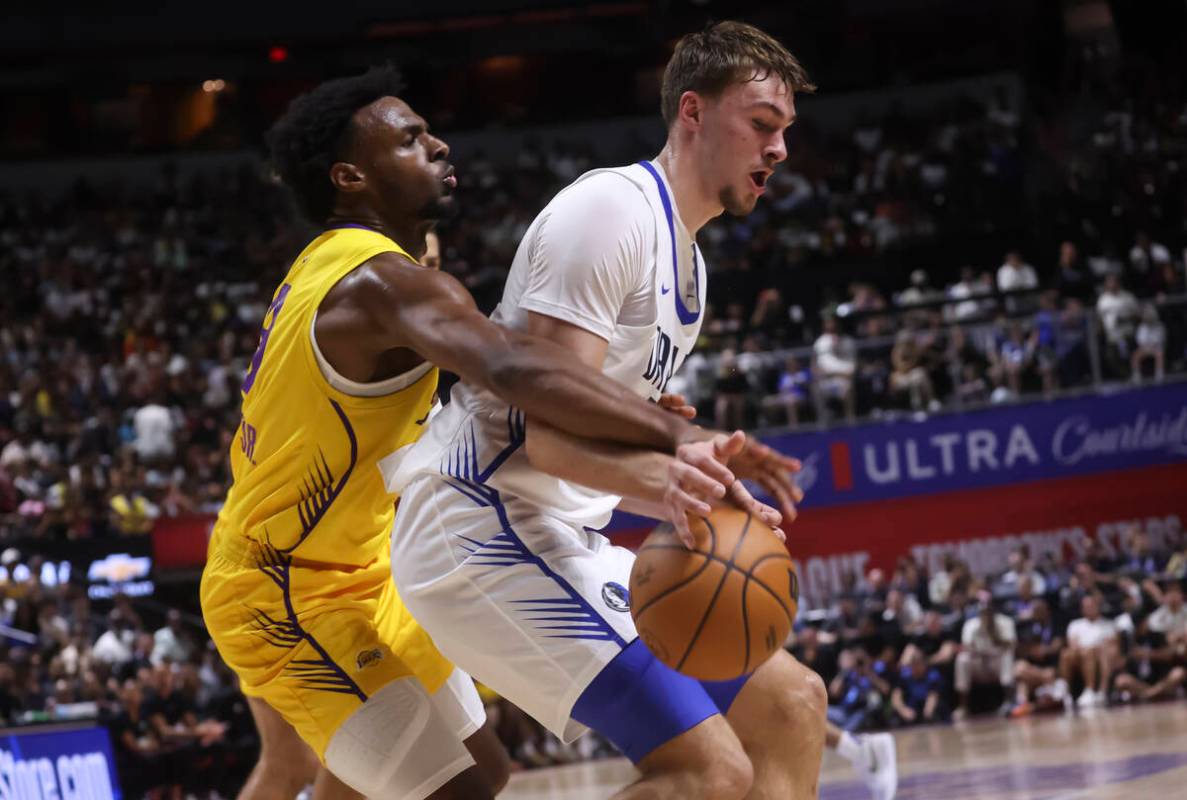 Los Angeles Lakers guard Bronny James, left, defends against Dallas Mavericks Cooper Flagg (32) ...
