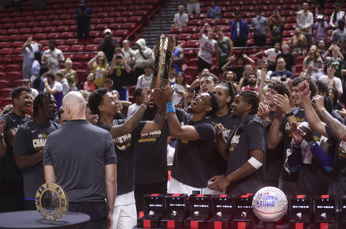 The Charlotte Hornets raise the trophy for their victory over the Sacramento Kings in the NBA S ...
