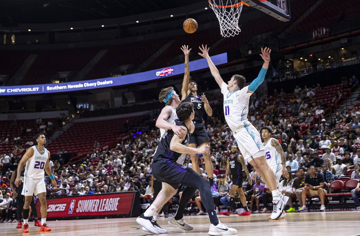 Sacramento Kings forward Nique Clifford (5) shoots over Charlotte Hornets center Ryan Kalkbrenn ...
