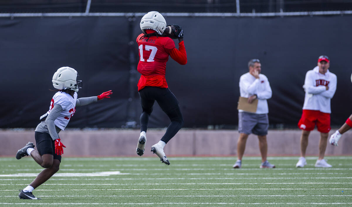 UNLV wide receiver Troy Omeire (17) elevates for a catch over defensive back Quandarius Keyes ...