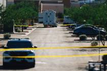 North Las Vegas police tape off a scene to investigate an officer involved shooting at Tropical ...