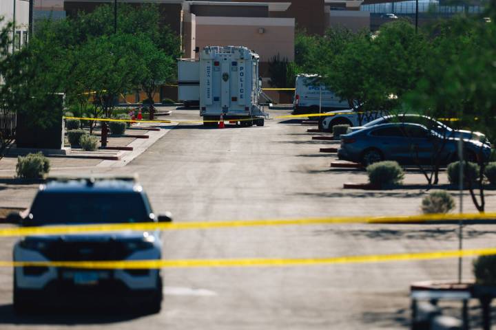 North Las Vegas police tape off a scene to investigate an officer involved shooting at Tropical ...