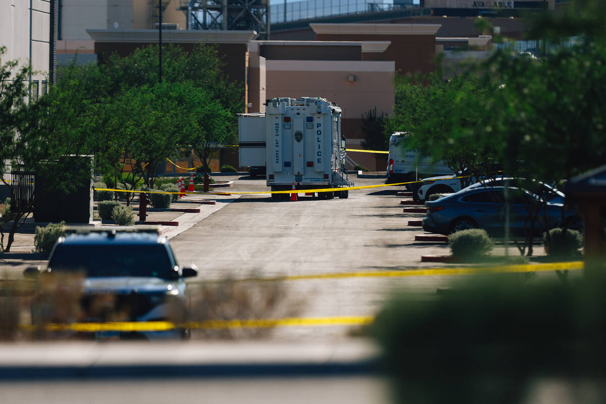 North Las Vegas police tape off a scene to investigate an officer involved shooting at Tropical ...