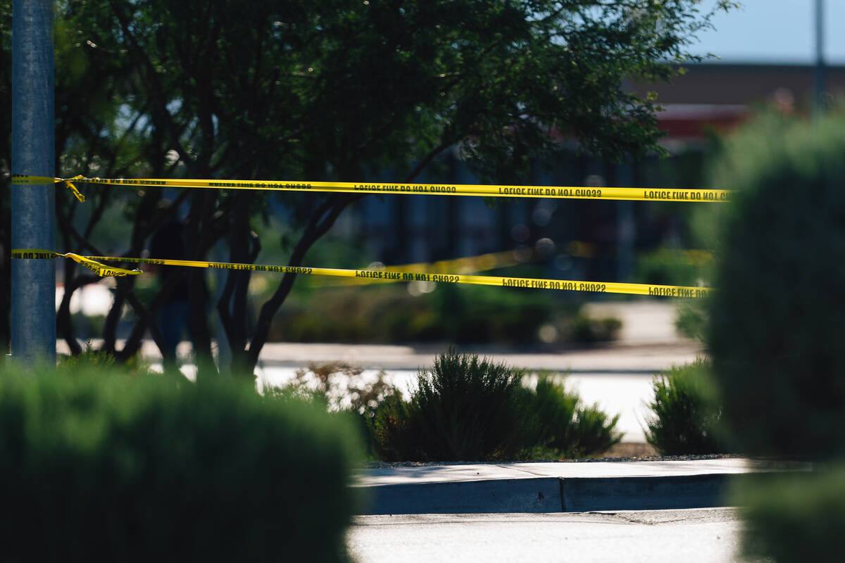 North Las Vegas police tape off a scene to investigate an officer involved shooting at Tropical ...