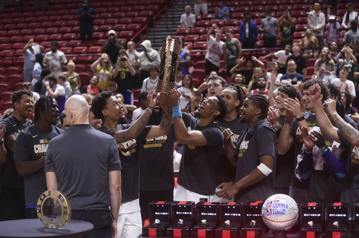 The Charlotte Hornets raise the trophy for their victory over the Sacramento Kings in the NBA S ...