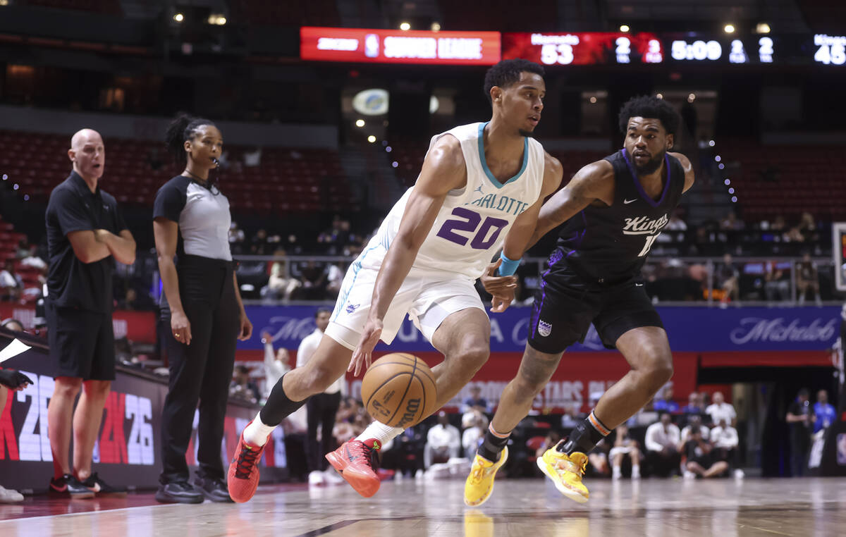 Charlotte Hornets guard/forward Jaylen Sims (20) drives the ball under pressure from Sacramento ...