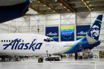 Alaska Airlines aircraft sits in the airline's hangar at Seattle-Tacoma International Airport, ...