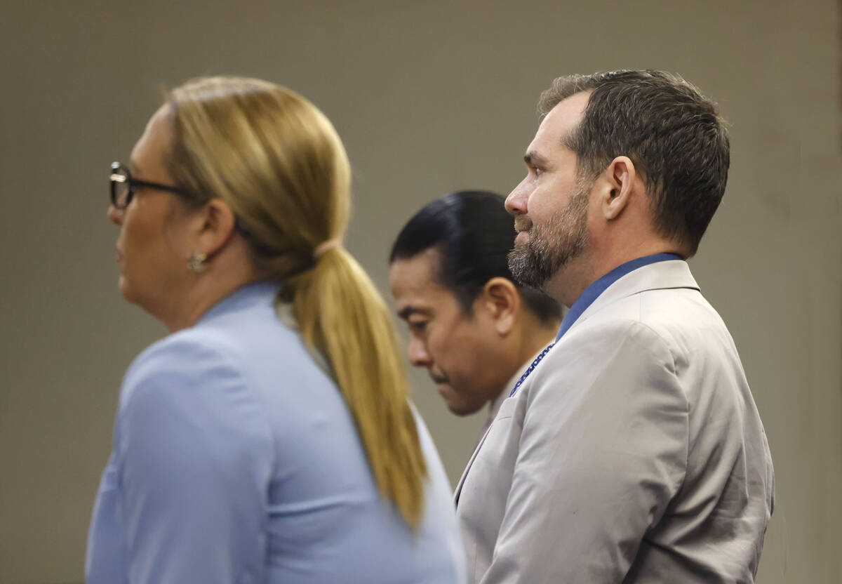 Christian Lentz, right, who pleaded guilty to a hate crime attack, appears in court with his at ...