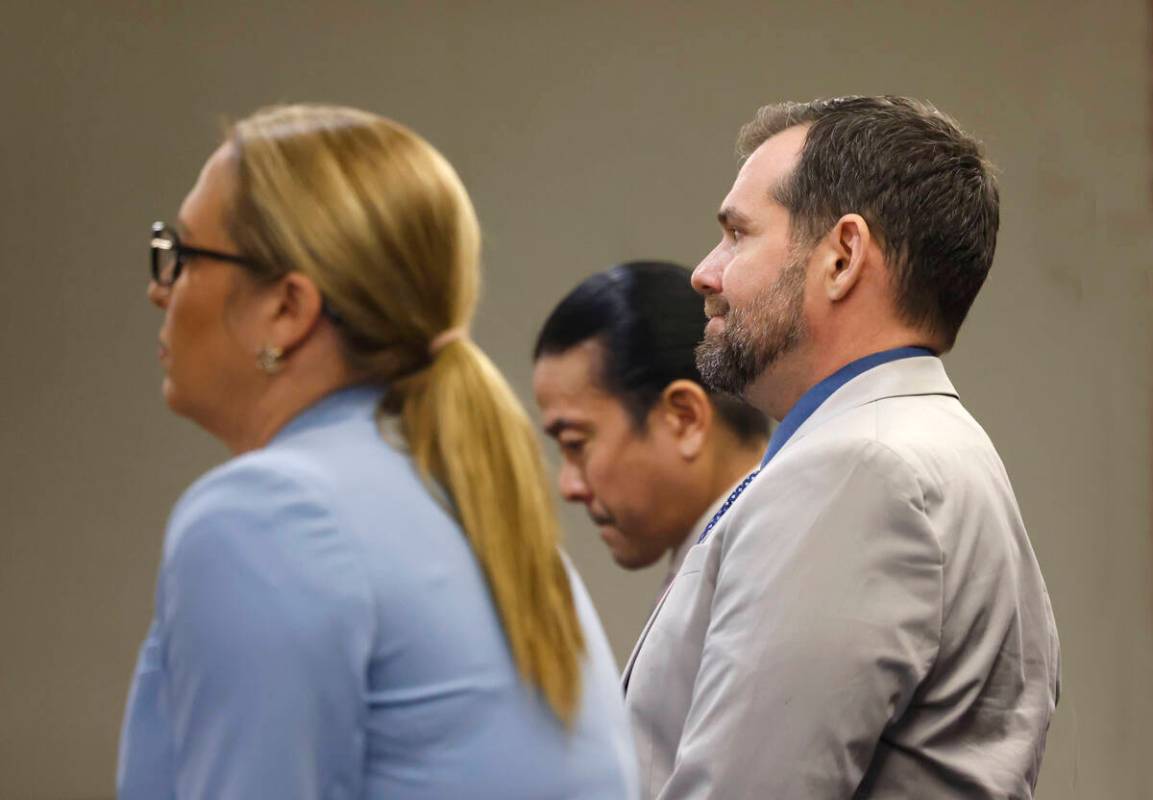 Christian Lentz, right, who pleaded guilty to a hate crime attack, appears in court with his at ...