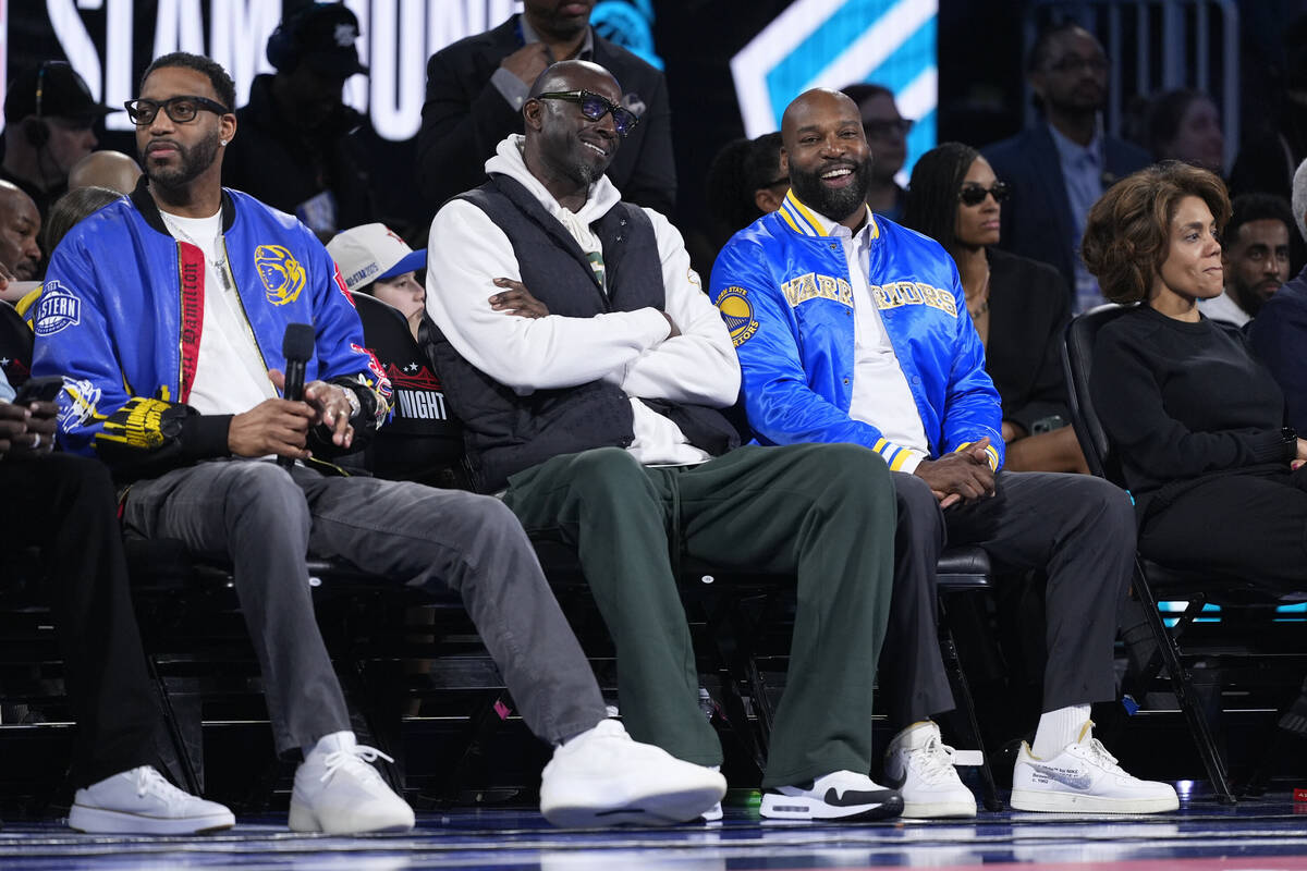 Tracy McGrady, Kevin Garnett and Baron Davis sit together at the NBA basketball All-Star Saturd ...