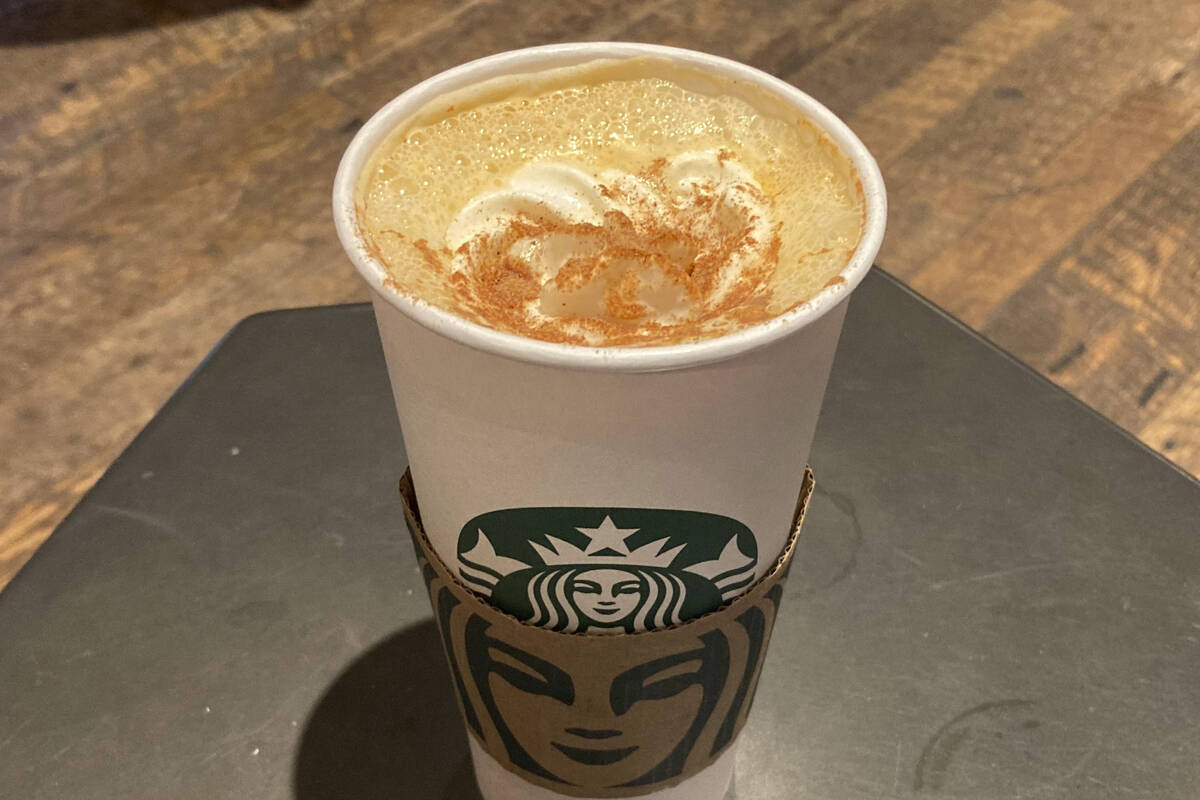 A Pumpkin Spice Latte drink rests on a table at a Starbucks in New York, on Thursday, Aug. 24, ...