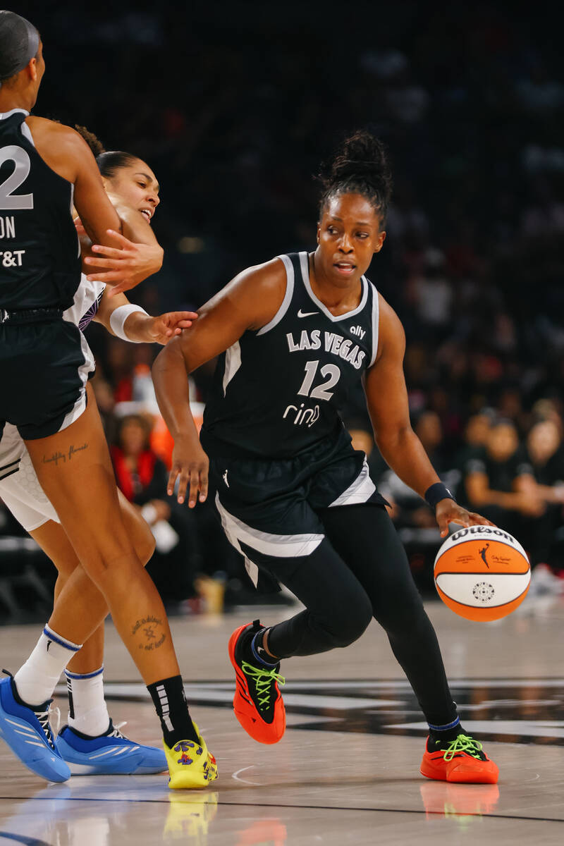 Las Vegas Aces guard Chelsea Gray (12) dribbles in the first half of a game between the Las Veg ...