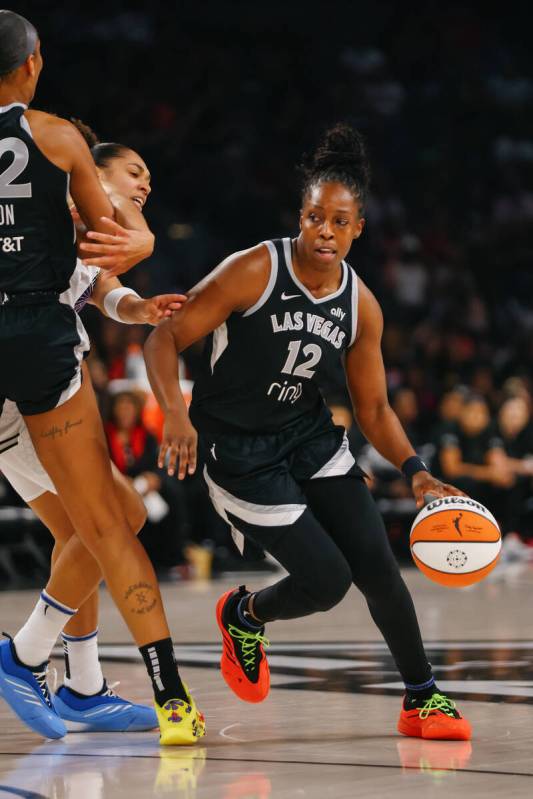 Las Vegas Aces guard Chelsea Gray (12) dribbles in the first half of a game between the Las Veg ...