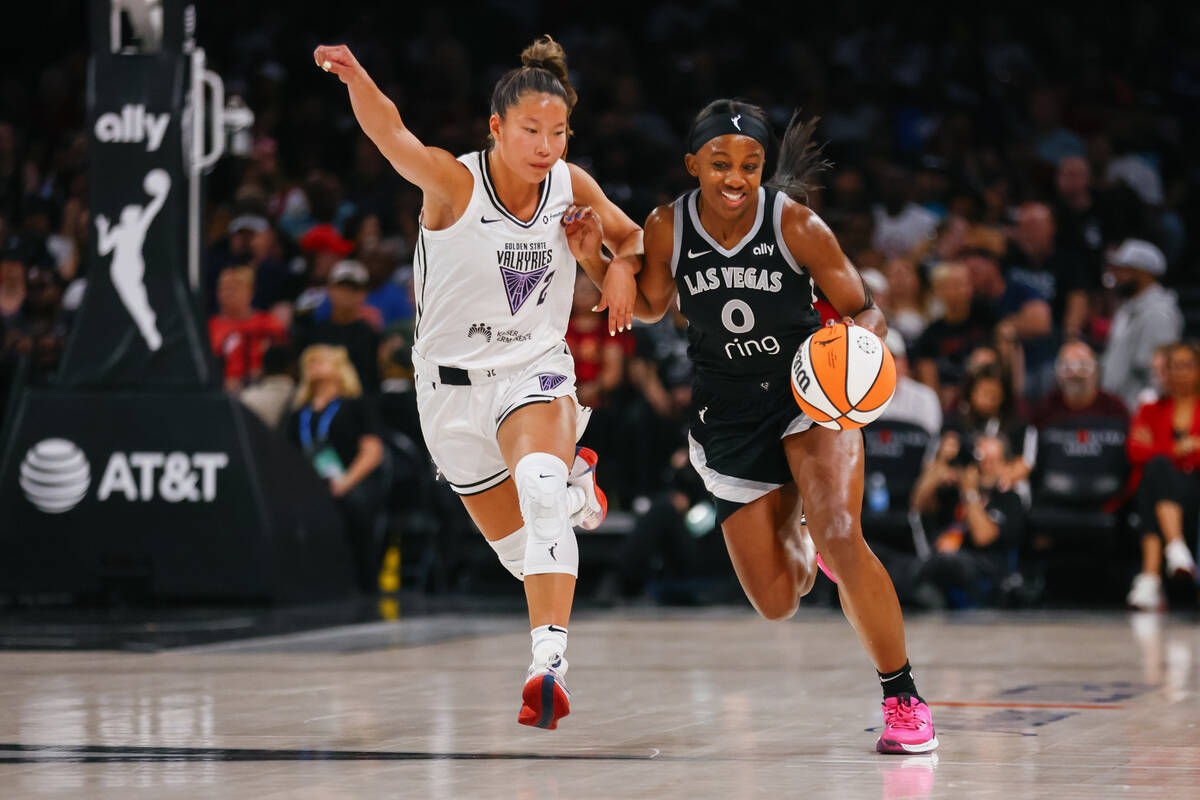 Las Vegas Aces guard Jackie Young (0) dribbles up the court against Golden State Valkyries guar ...