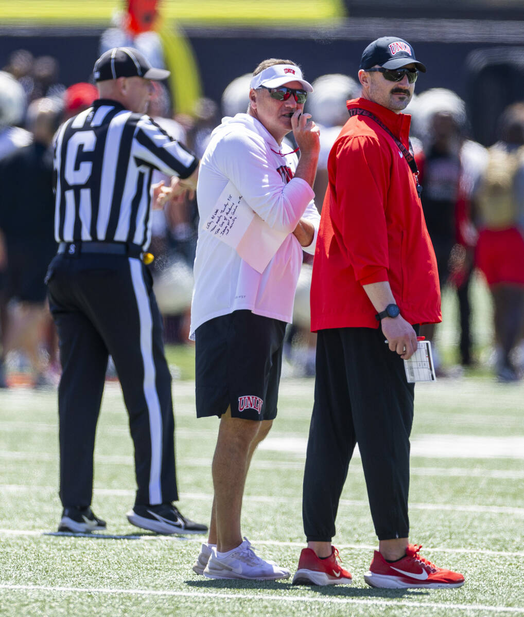 Head Coach Dan Mullen has a chat during UNLV spring football practice at the Fertitta Football ...