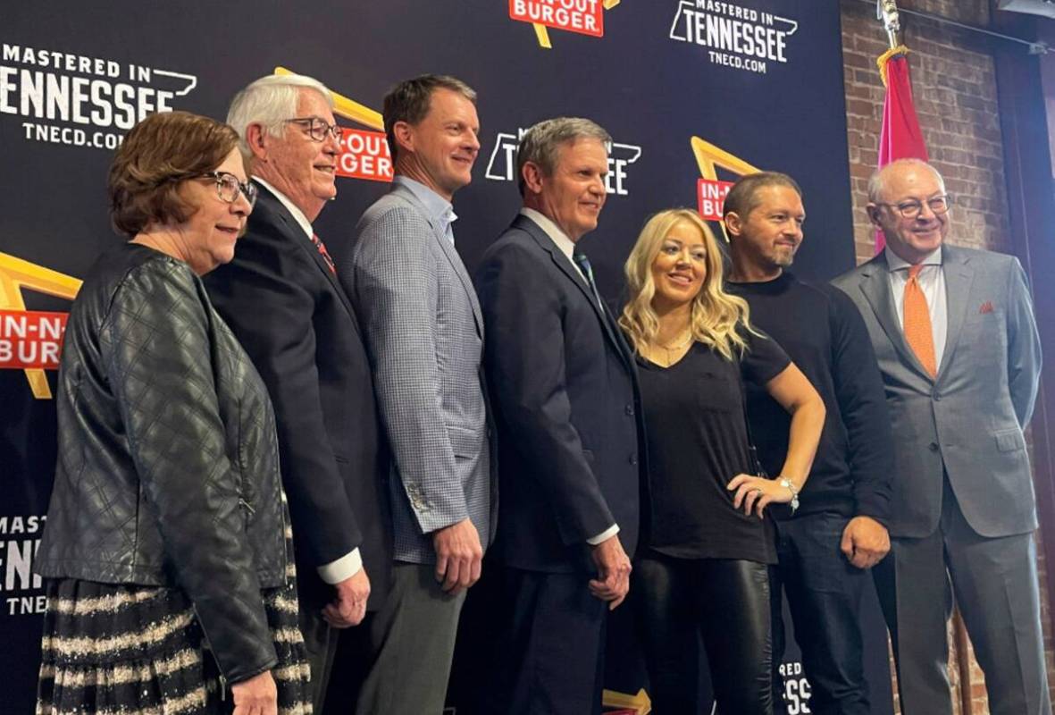 Tennessee Gov. Bill Lee, center, poses with In-N-Out Burger owner and President Lynsi Snyder, t ...