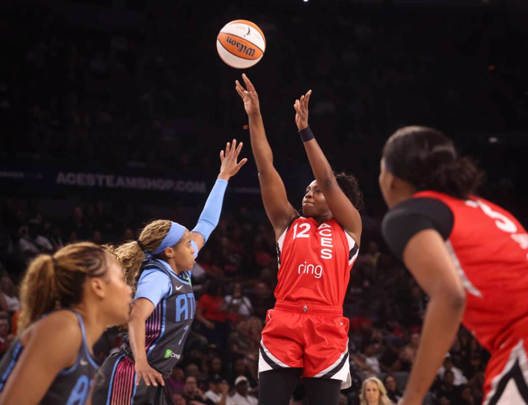 Aces guard Chelsea Gray (12) shoots over Atlanta Dream guard Jordin Canada (3) during the firs ...