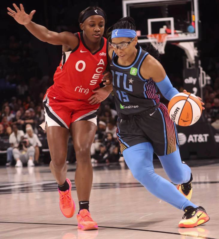 Atlanta Dream guard Allisha Gray (15) drives the ball against Aces guard Jackie Young (0) durin ...