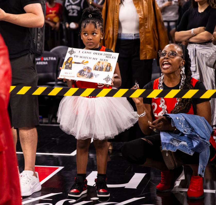 A young fan looks to the court after the Aces defeated the Atlanta Dream in a WNBA basketball g ...