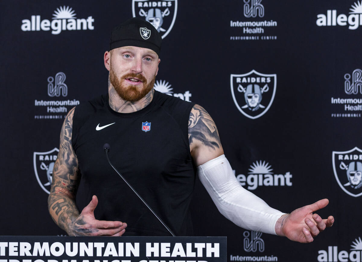 Raiders defensive end Maxx Crosby (98) speaks during an interview on the first day of training ...