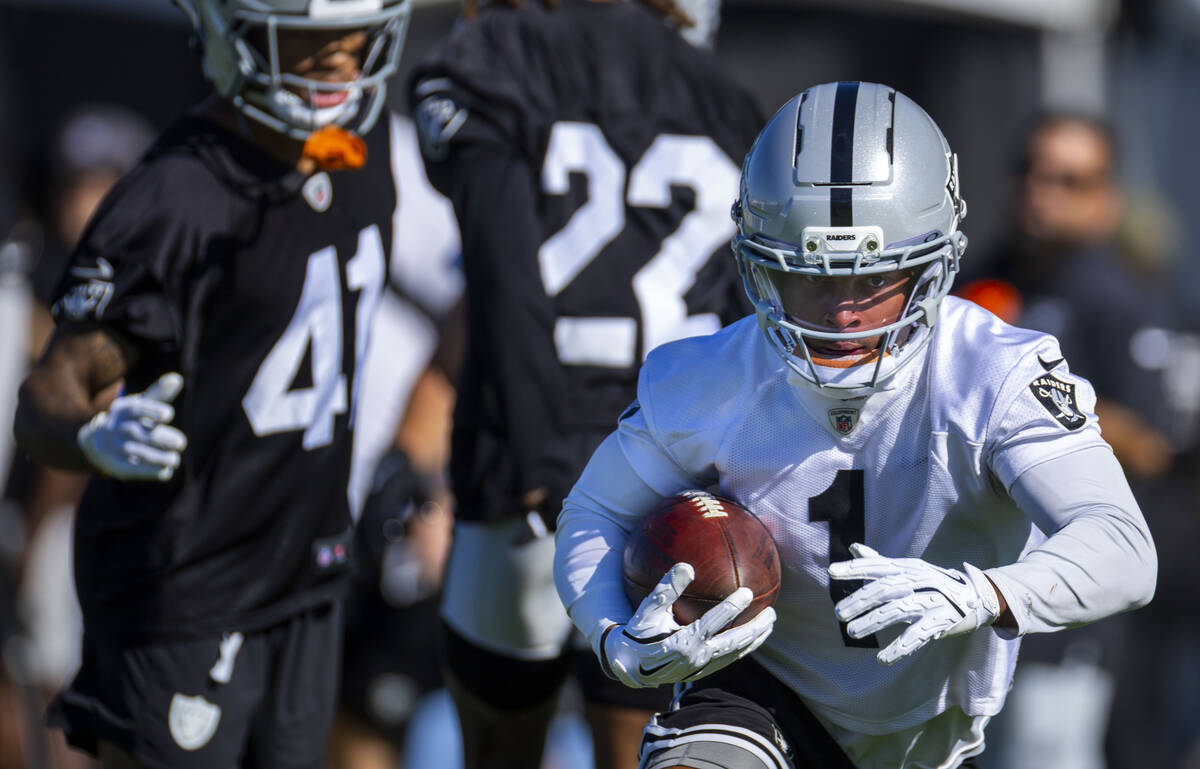 Raiders wide receiver Tre Tucker (1) runs back a punt watches a drill during the first day of t ...