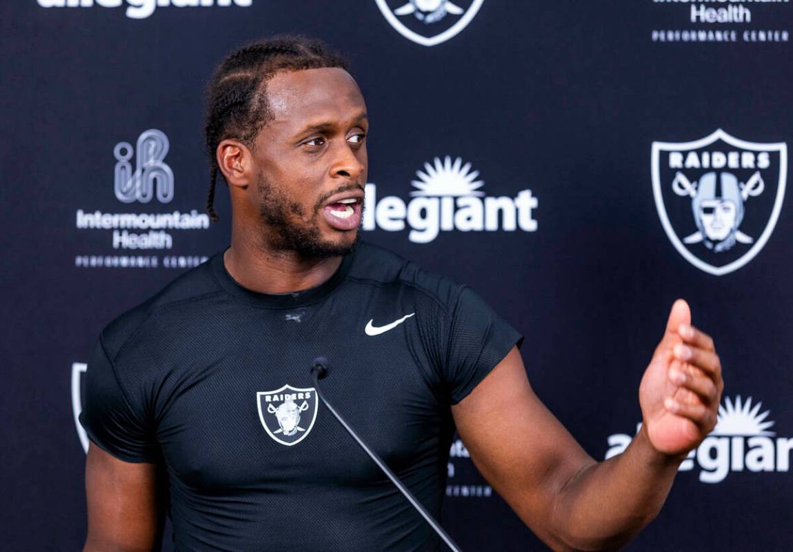 Raiders quarterback Geno Smith (7) speaks during an interview on the first day of training camp ...