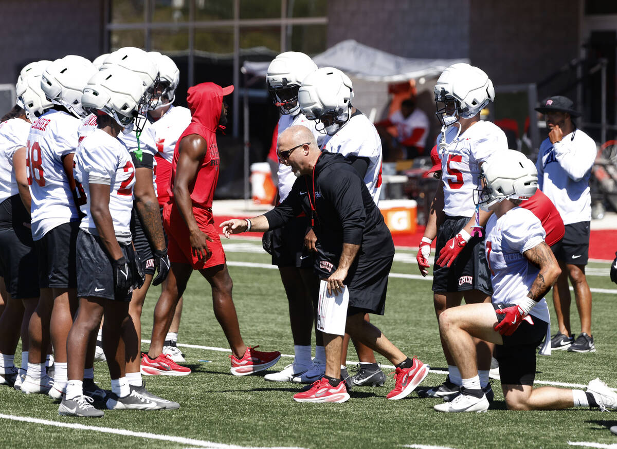 UNLV special teams coordinator Adam Scheier, center, talks to players during the first day of f ...