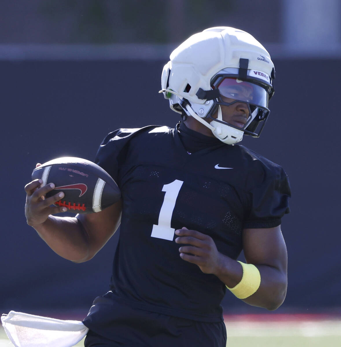 UNLV quarterback Alex Orji (1) runs with the ball during the first day of football camp at the ...