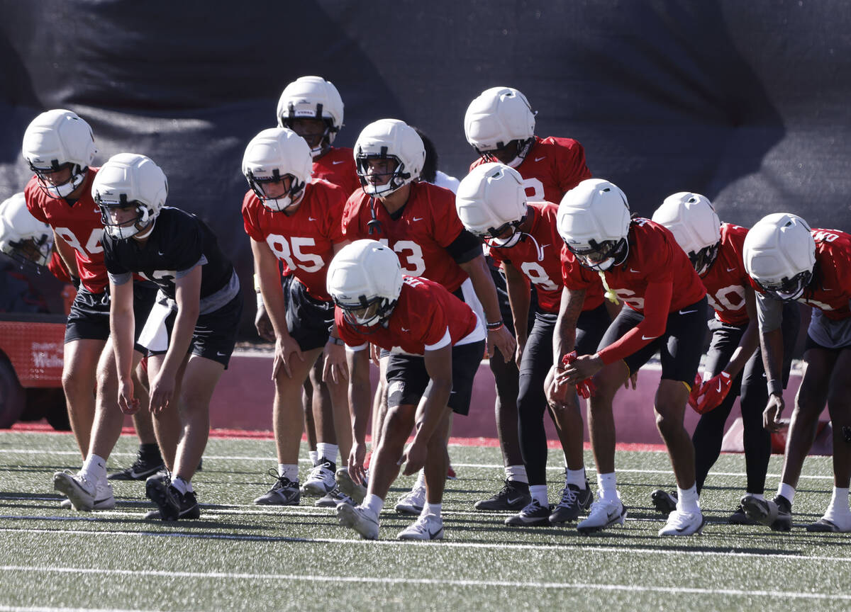 UNLV players stretch during the first day of football camp at the Fertitta Football Complex on ...