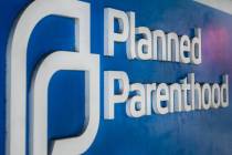 Morning light shines on the entrance sign at a Planned Parenthood clinic in Walnut Creek, Calif ...