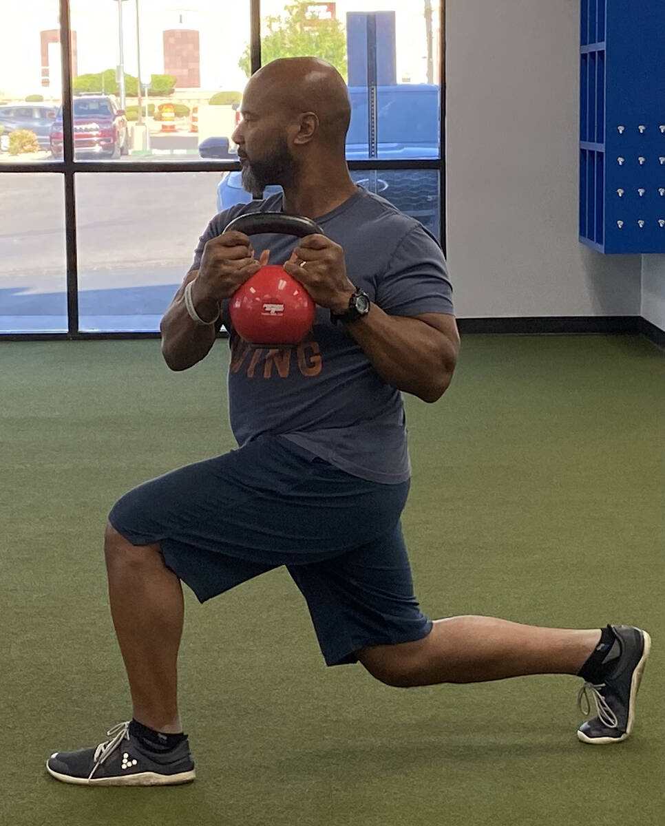 The author performs a lunge with rotating load, an example of an exercise that helps strengthen ...