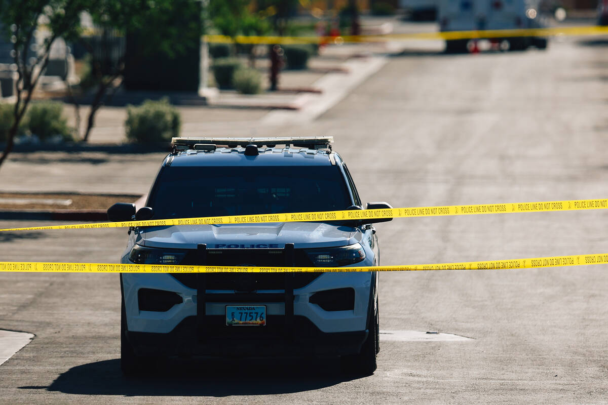 North Las Vegas police tape off a scene to investigate an officer involved shooting at Tropical ...