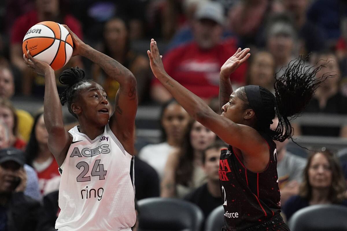 Las Vegas Aces' Jewell Loyd (24) shoots against Indiana Fever's Aari McDonald (2) during the fi ...