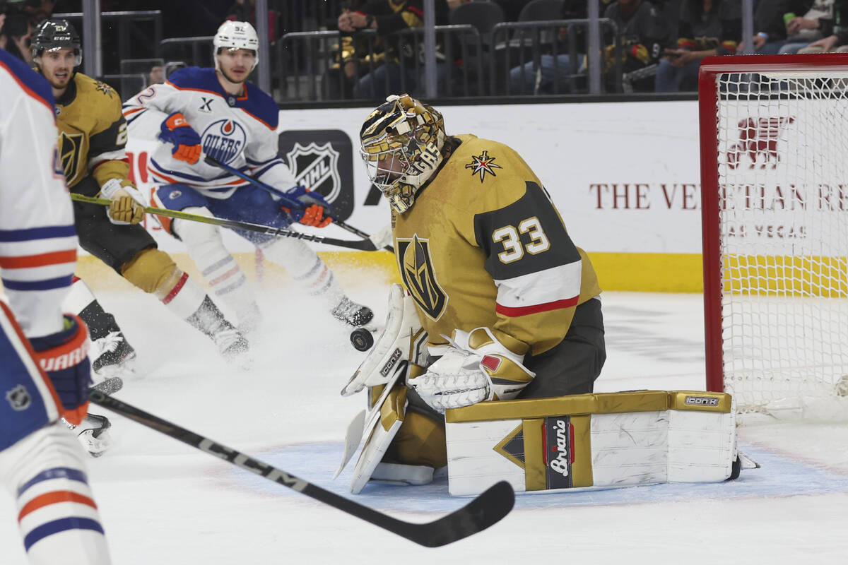 Golden Knights goaltender Adin Hill (33) blocks a shot from the Edmonton Oilers during the seco ...