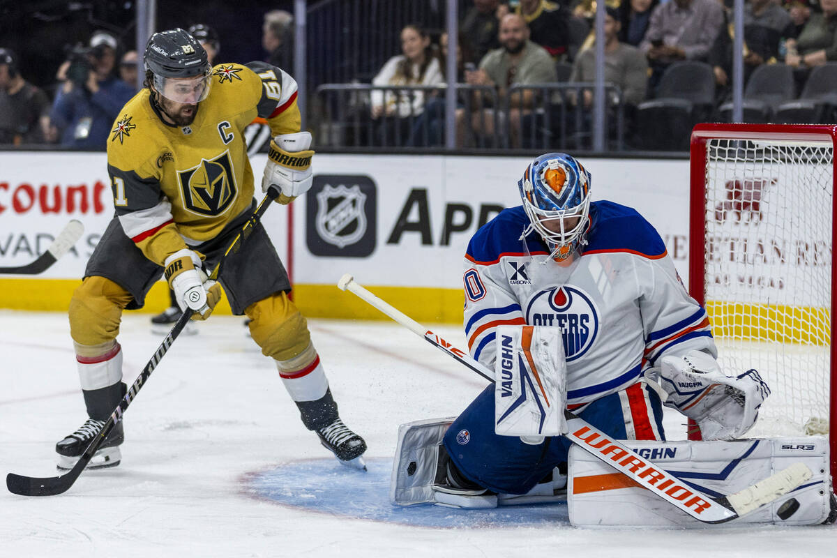 Golden Knights right wing Mark Stone (61) watches as a puck is blocked by Edmonton Oilers goalt ...