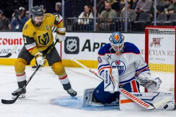 Golden Knights right wing Mark Stone (61) watches as a puck is blocked by Edmonton Oilers goalt ...
